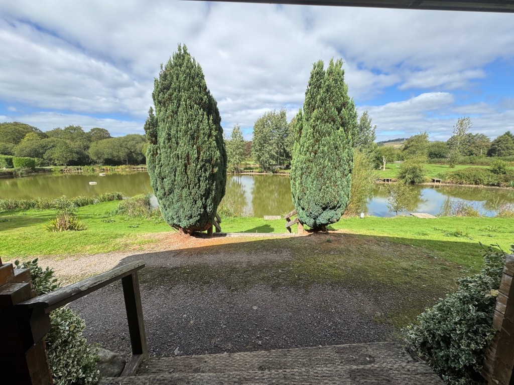 Lot: 71 - FREEHOLD TEN ACRE SITE WITH LAKES AND LODGES - View from Heron Lodge veranda